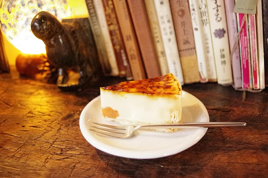 cake-books-cafe-cheese-cake-lamp-book-table-brown-wood.jpg