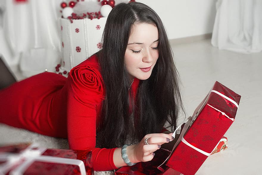 new-year-s-eve-brunette-with-gift-beautiful-girl-beauty-red-dress-long-hair-nice-moment-surpri...jpg